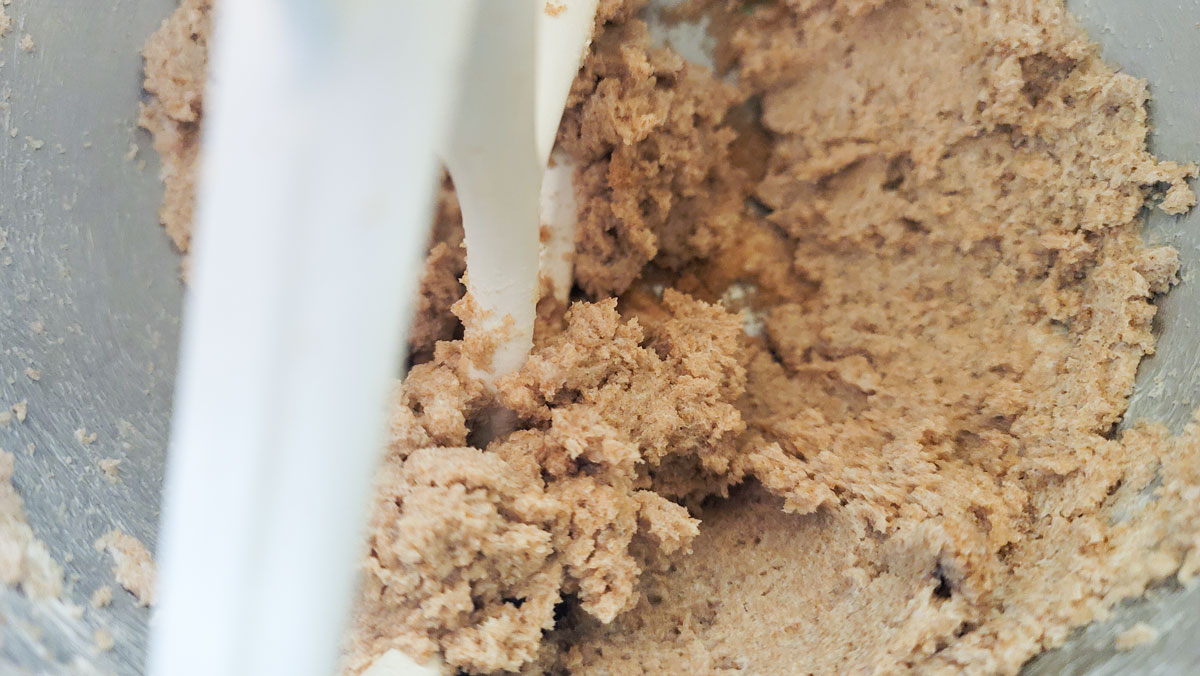 Butter and sugar creamed together in a mixing bowl.