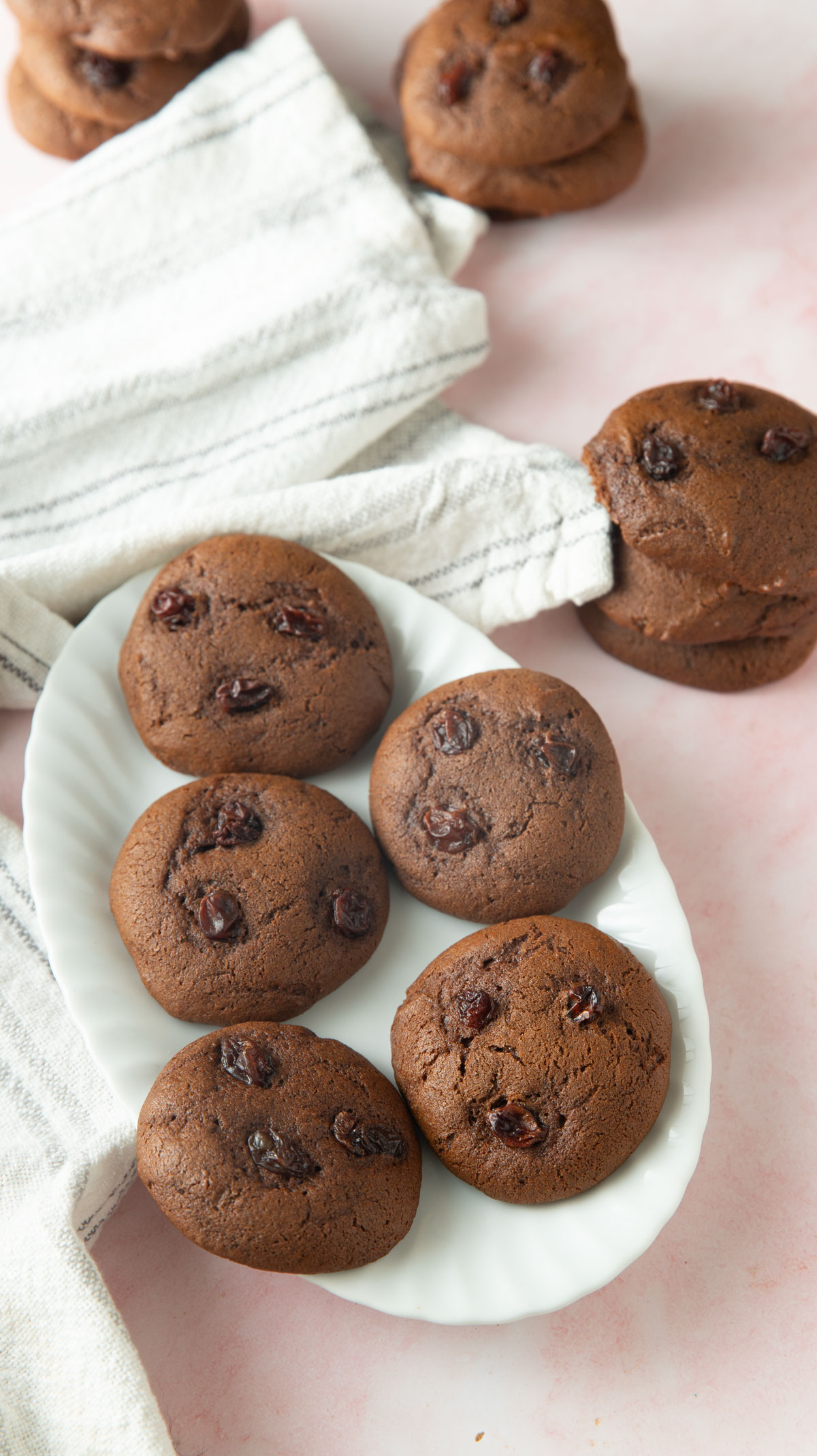 Molasses cookies on a white serving plate.