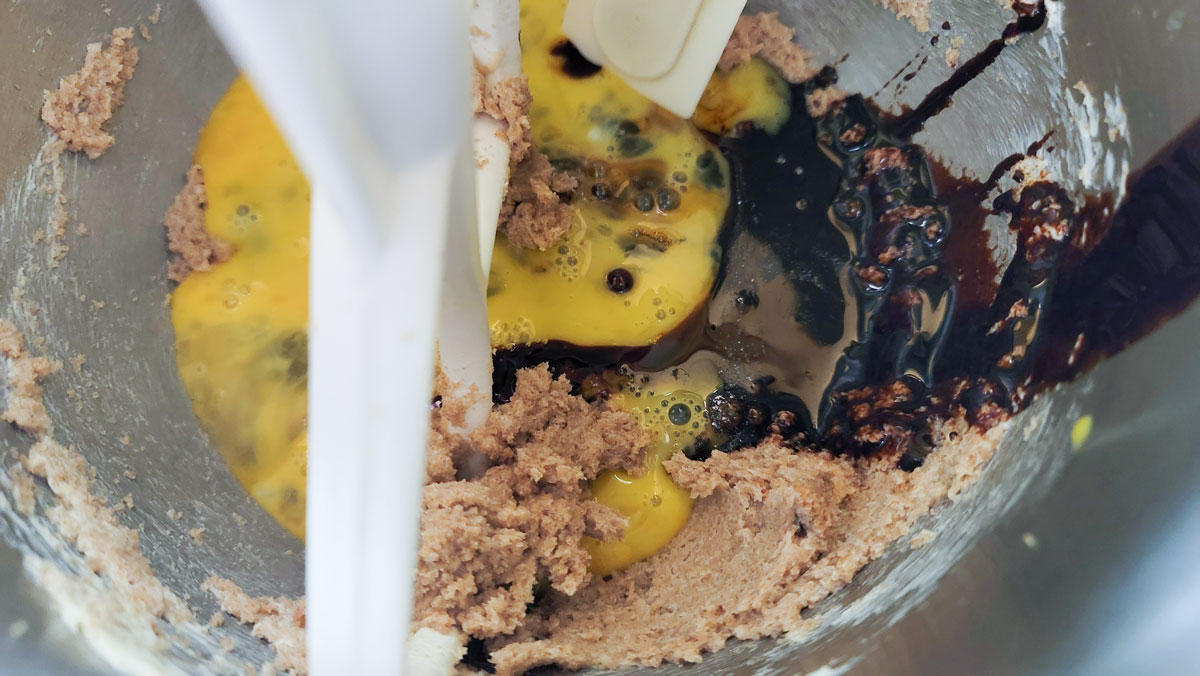 Eggs and molasses added to the creamed ingredients.