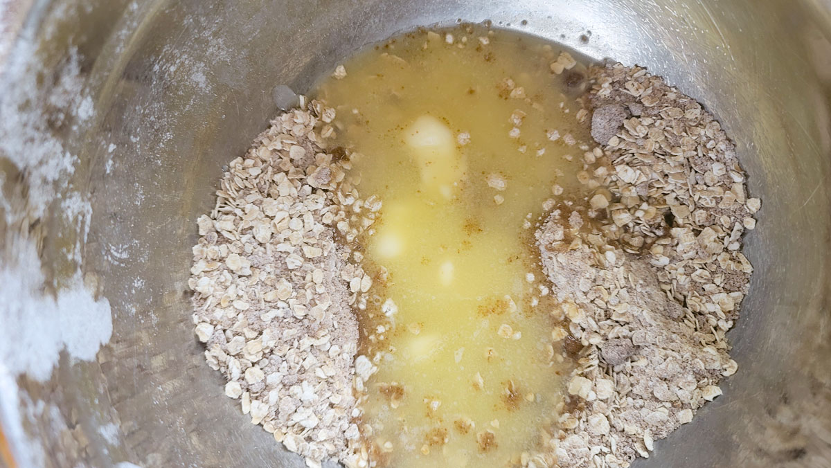 Melted butter added to the crumb ingredients.