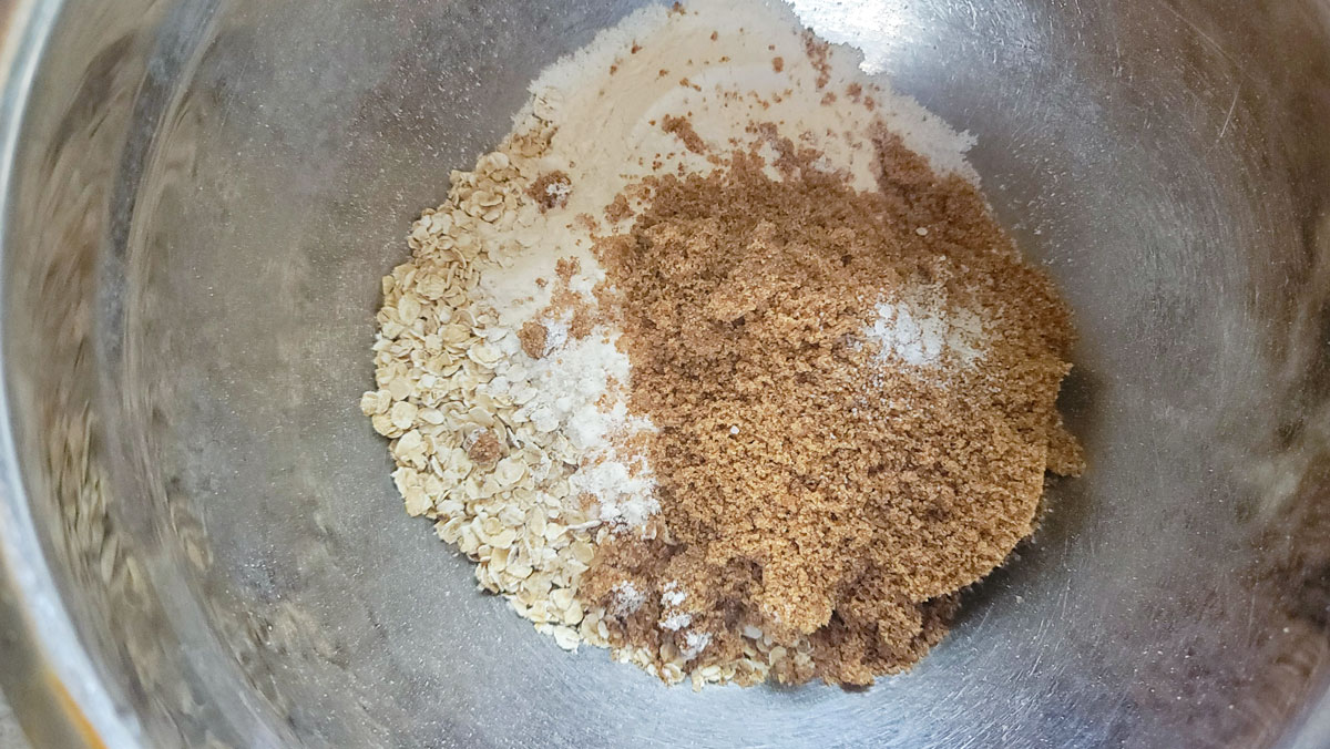 Ingredients for the crumb topping added to a bowl.