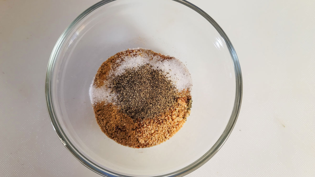 Spices added to a small bowl.