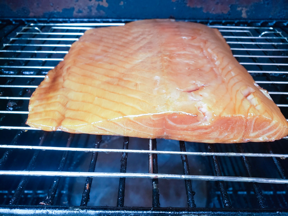 Salmon filet in the smoker.