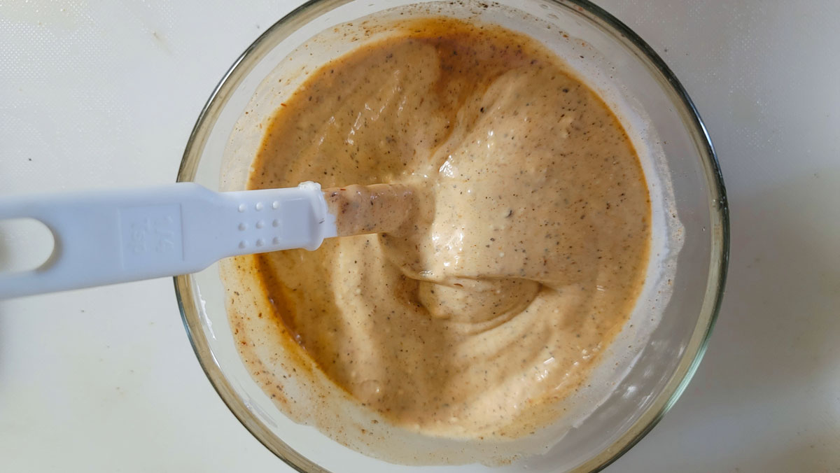 Dressing ingredients mixed in the bowl.