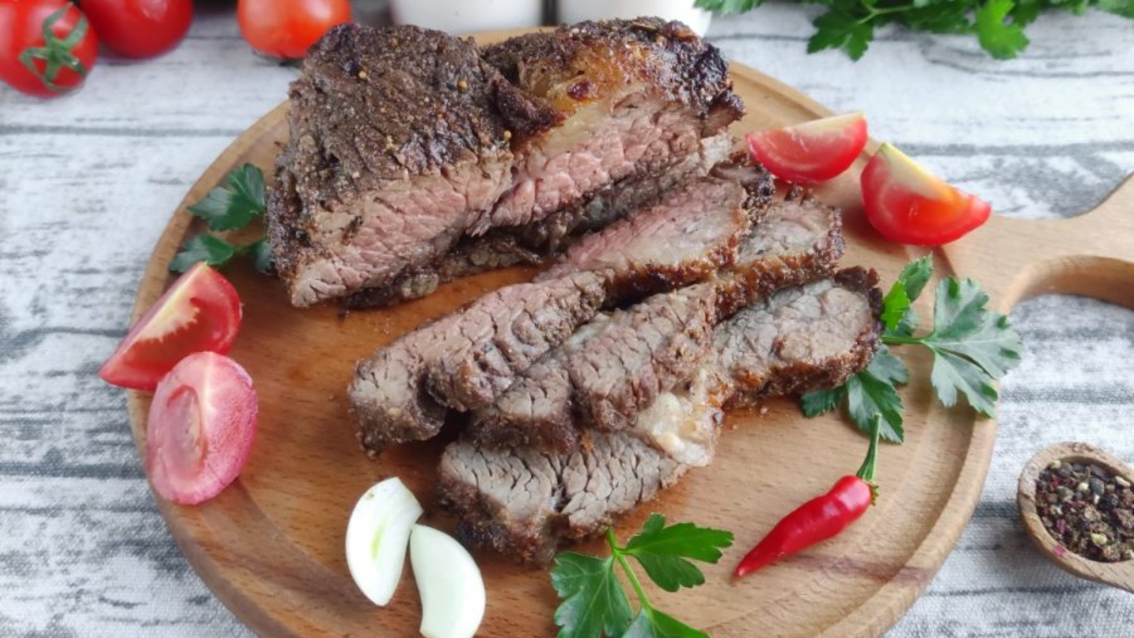 Steak on a chopping board.