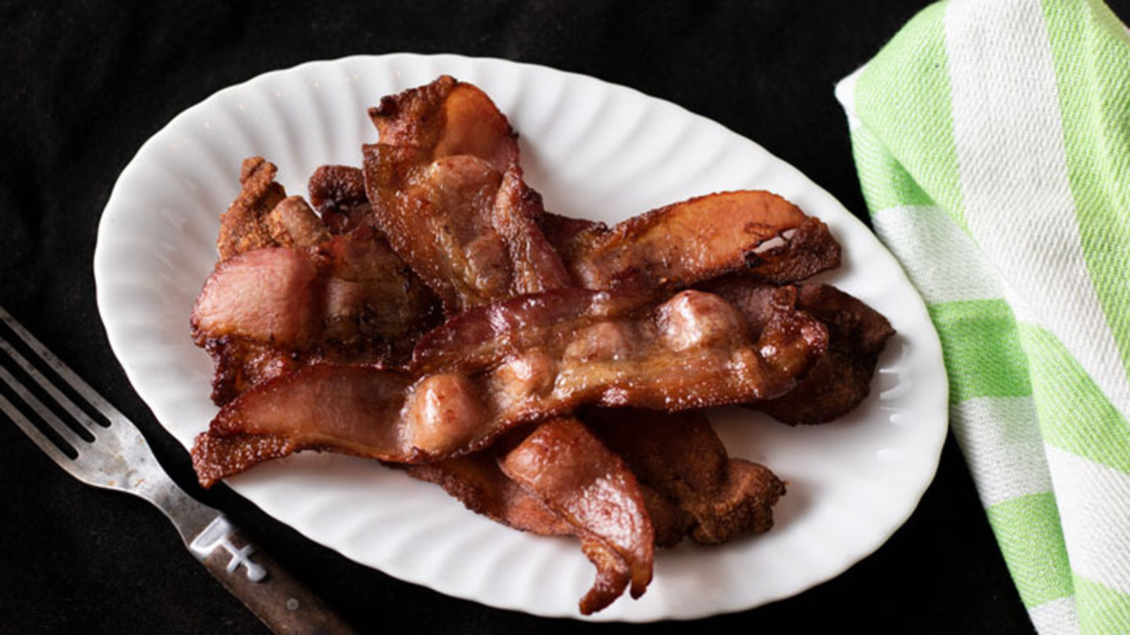 Air fried bacon on a plate.