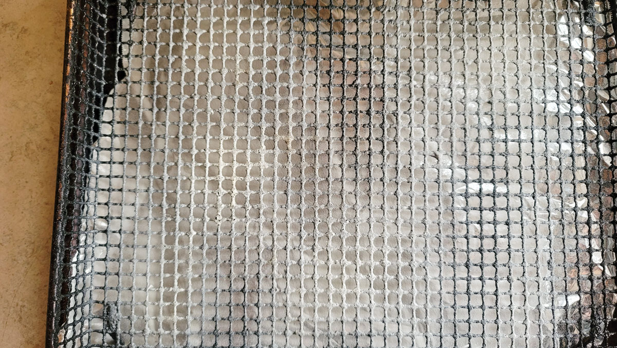 Air fryer basket sprayed with no-stick spray.