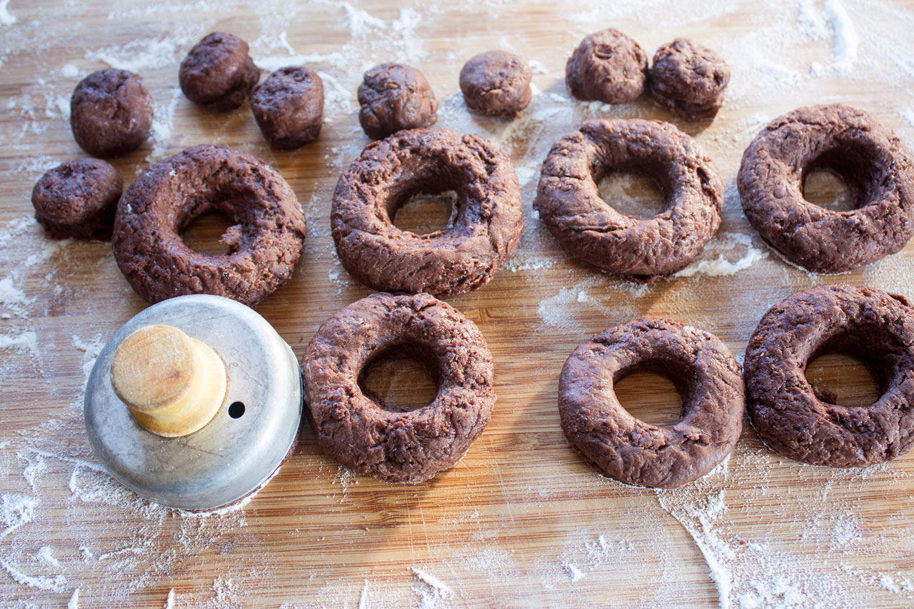 Cut out doughnuts with a biscuit cutter.