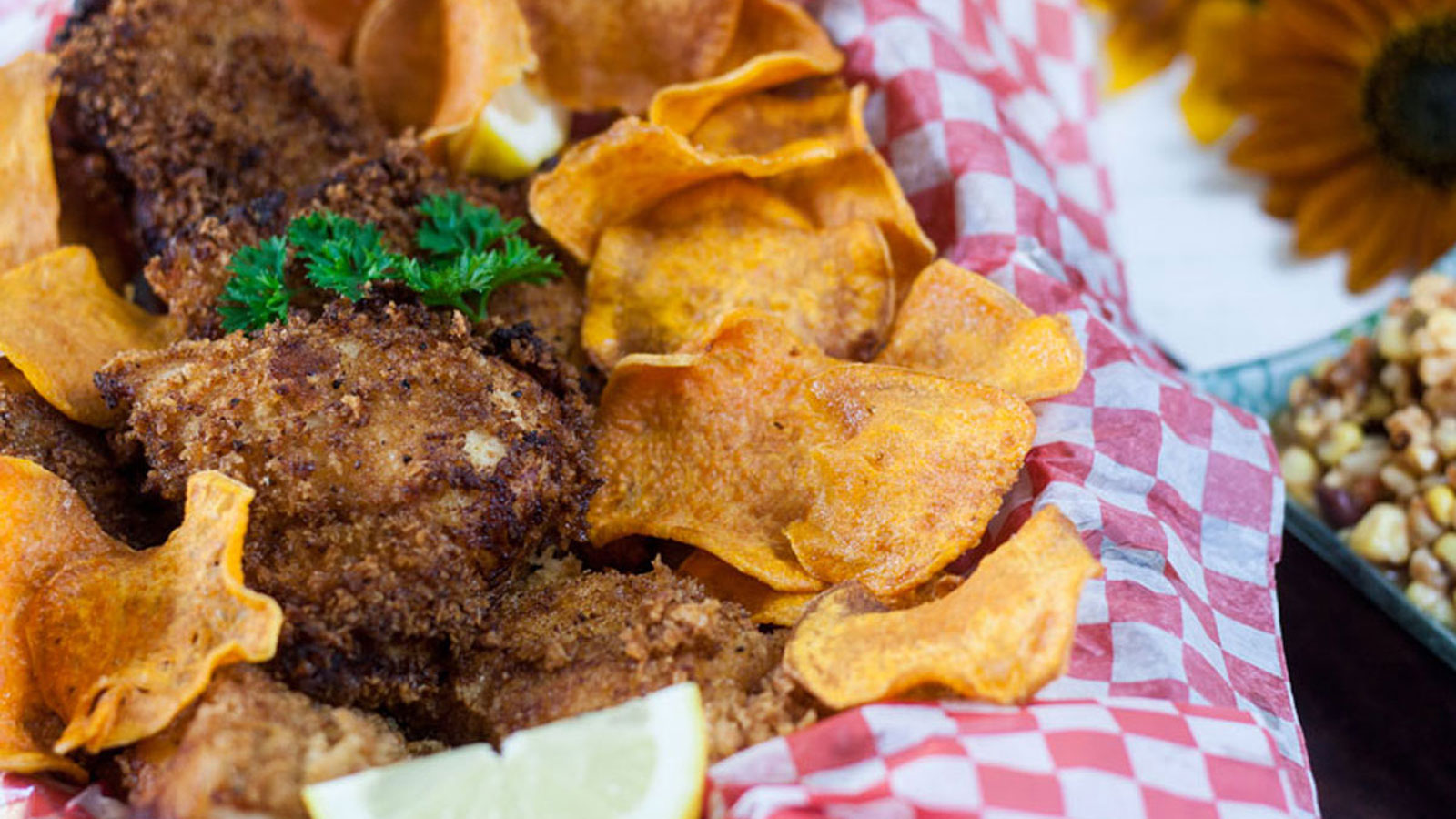 Fish and chips in basket with corn salsa