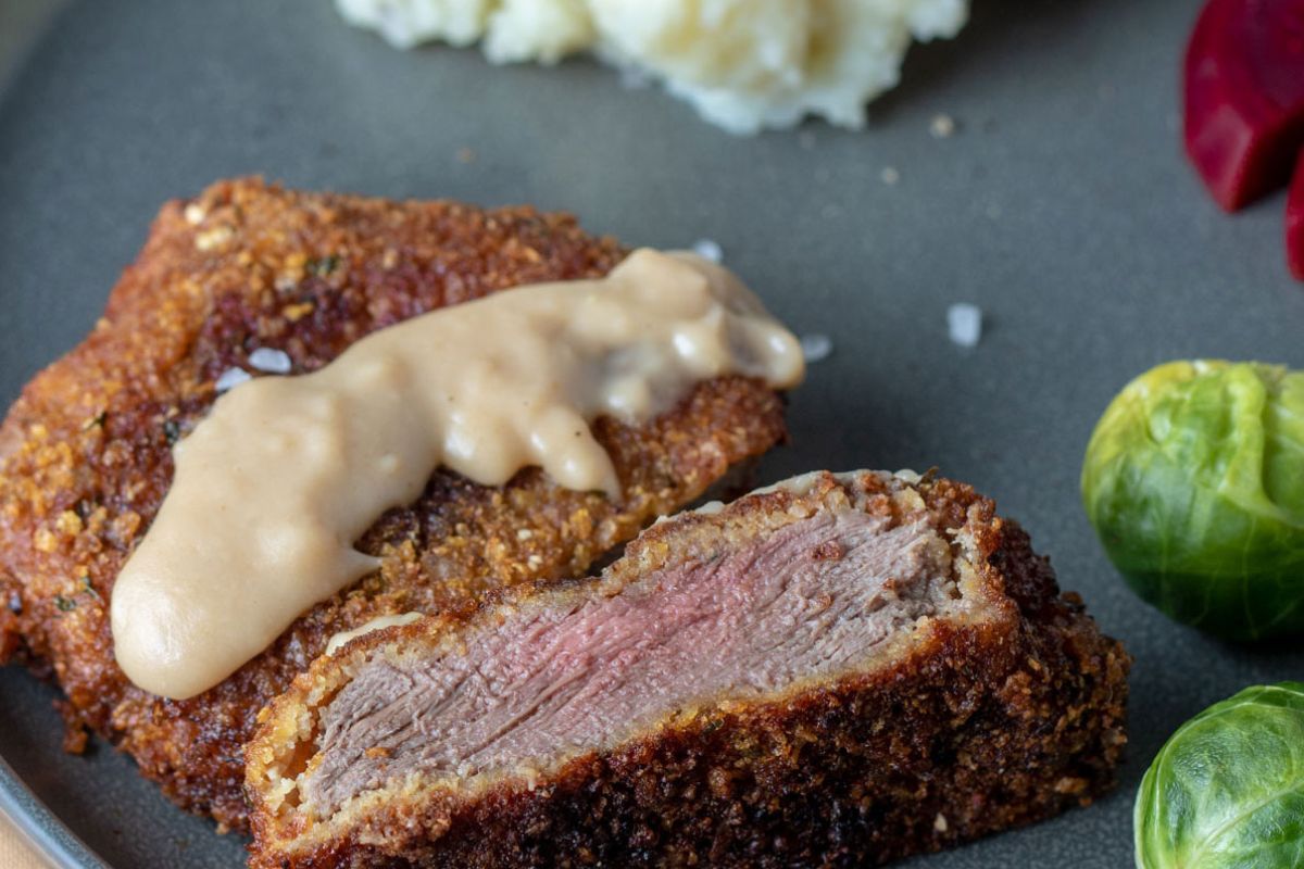 Breaded venison loin served with mashed potatoes, and steamed broccoli. 