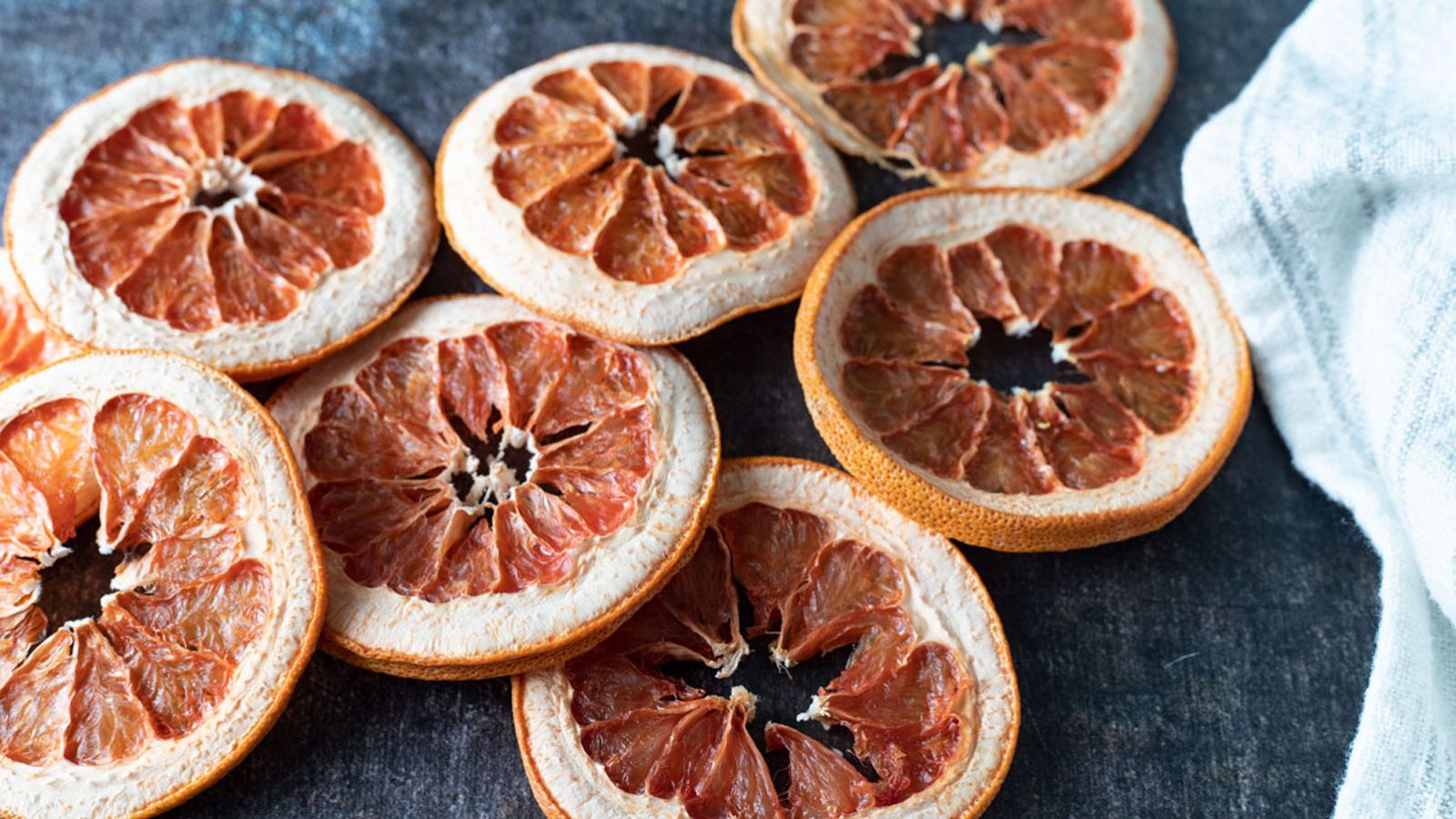 Dehydrated grapefruit on white background.