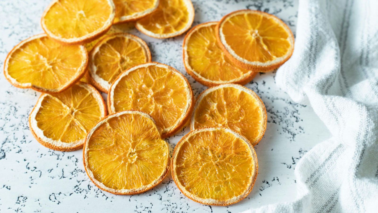 Orange slices arranged on white background.