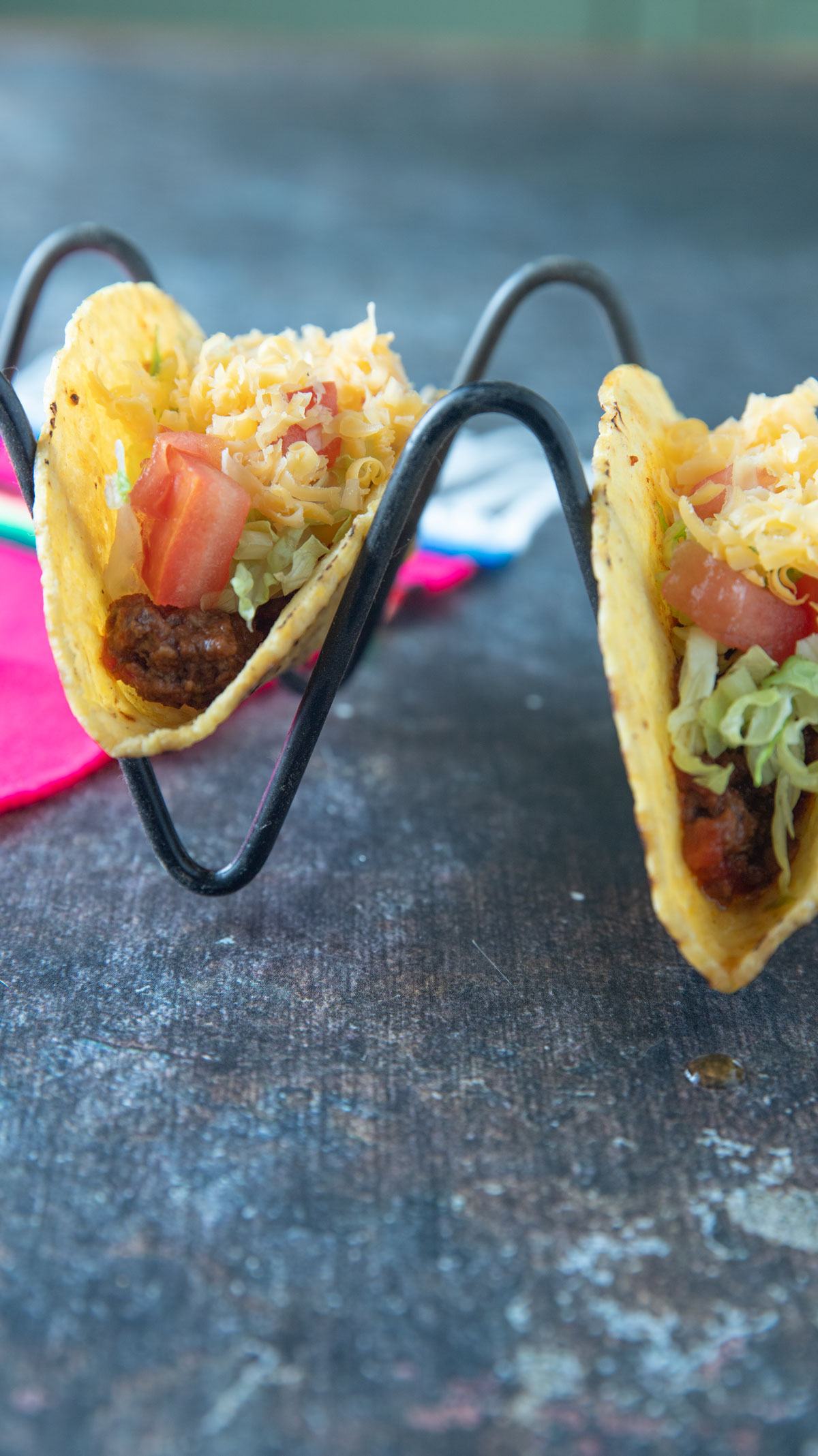 Ground beef tacos in hard taco shells.