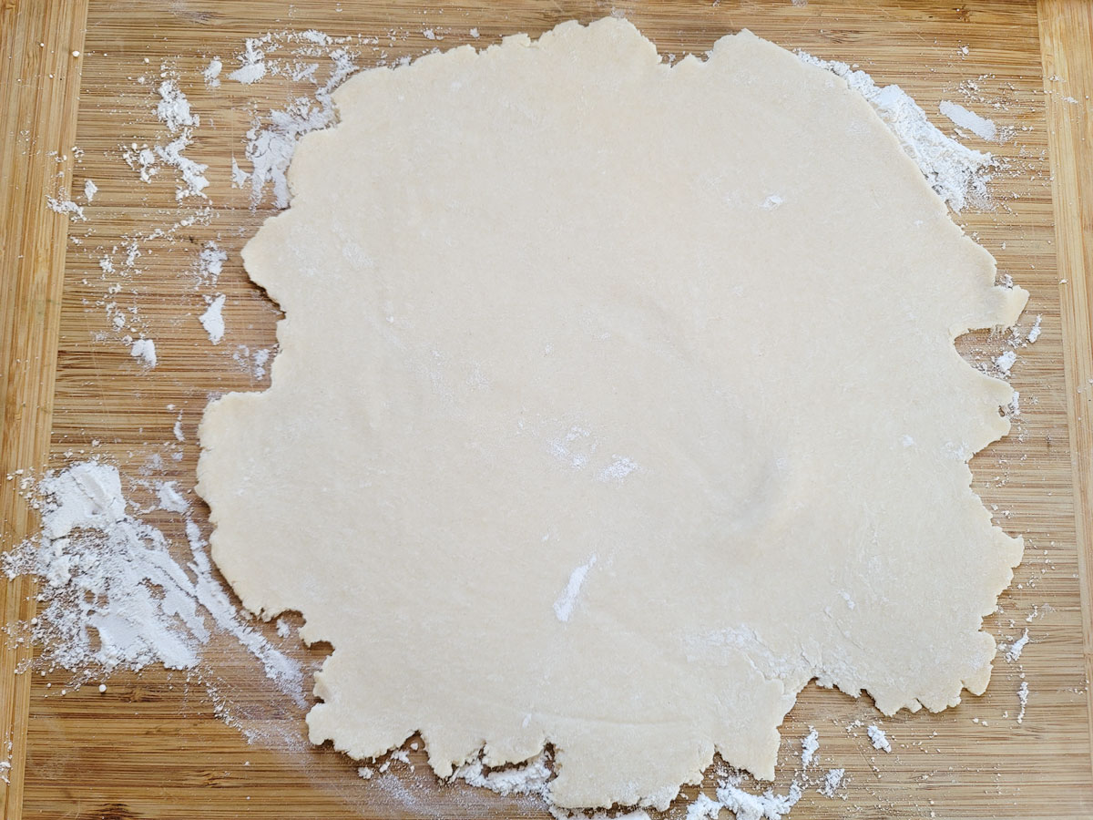 Dough rolled into a circle.