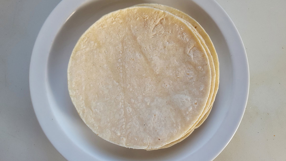 Tortillas on a microwave safe plate.