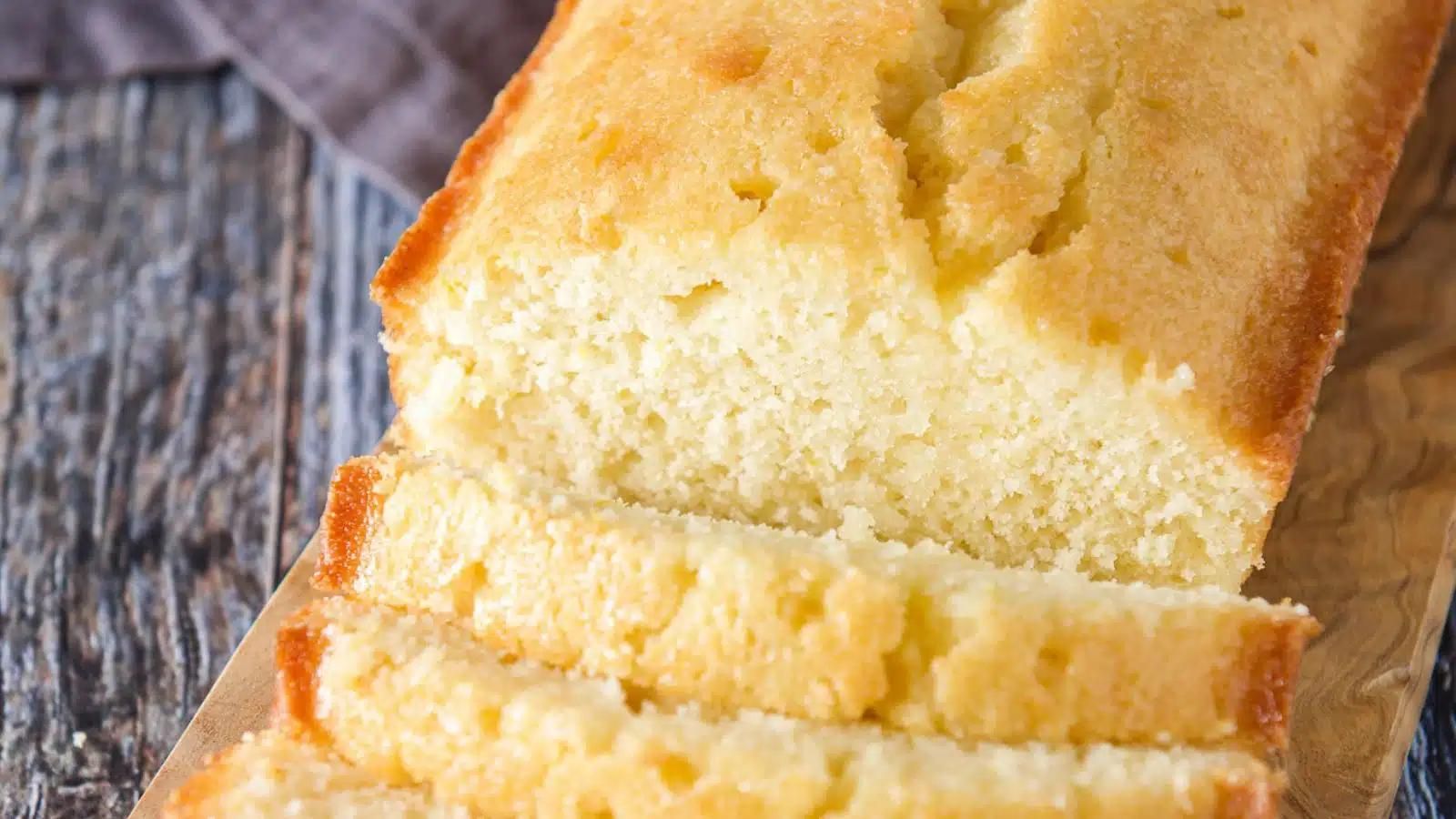 Closeup of citrus bread - lemon, sliced on a cutting board.