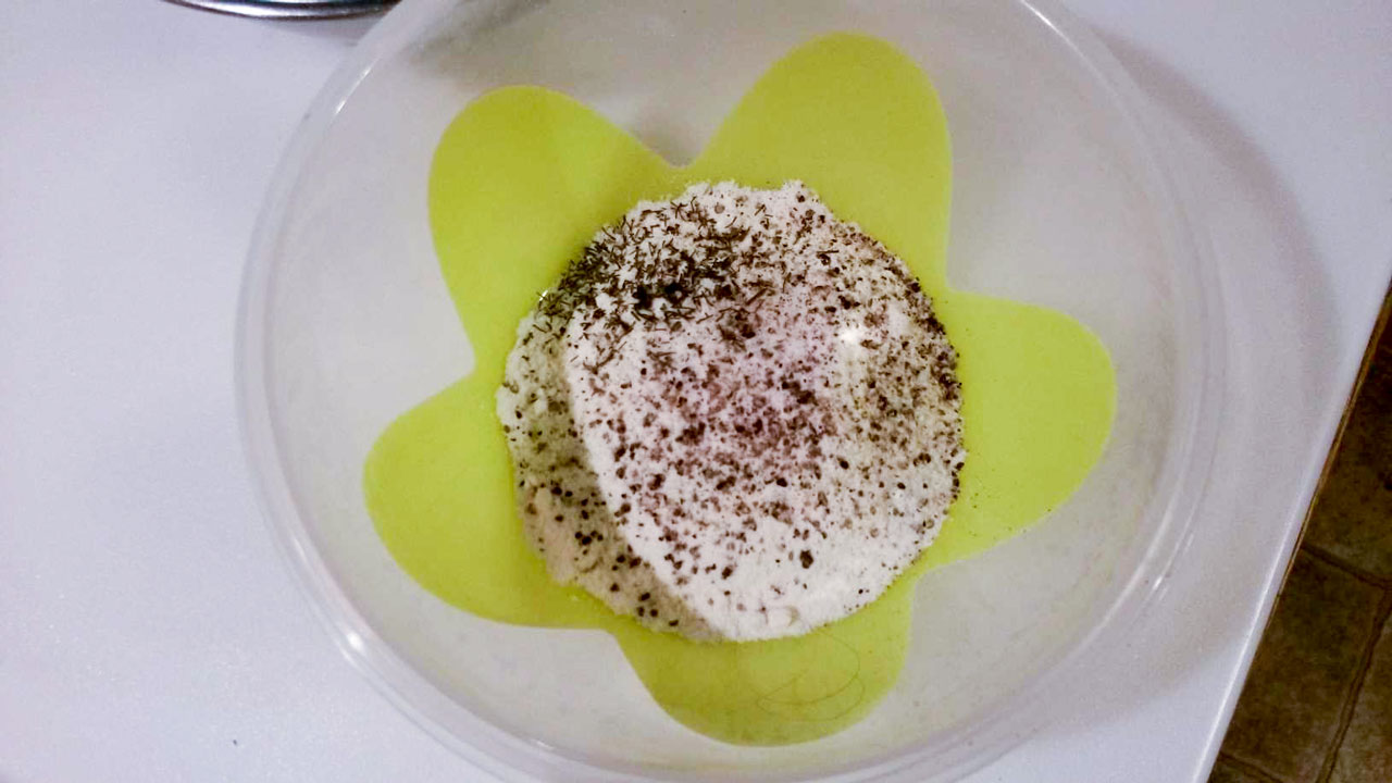 Flour, salt and pepper in a small bowl.