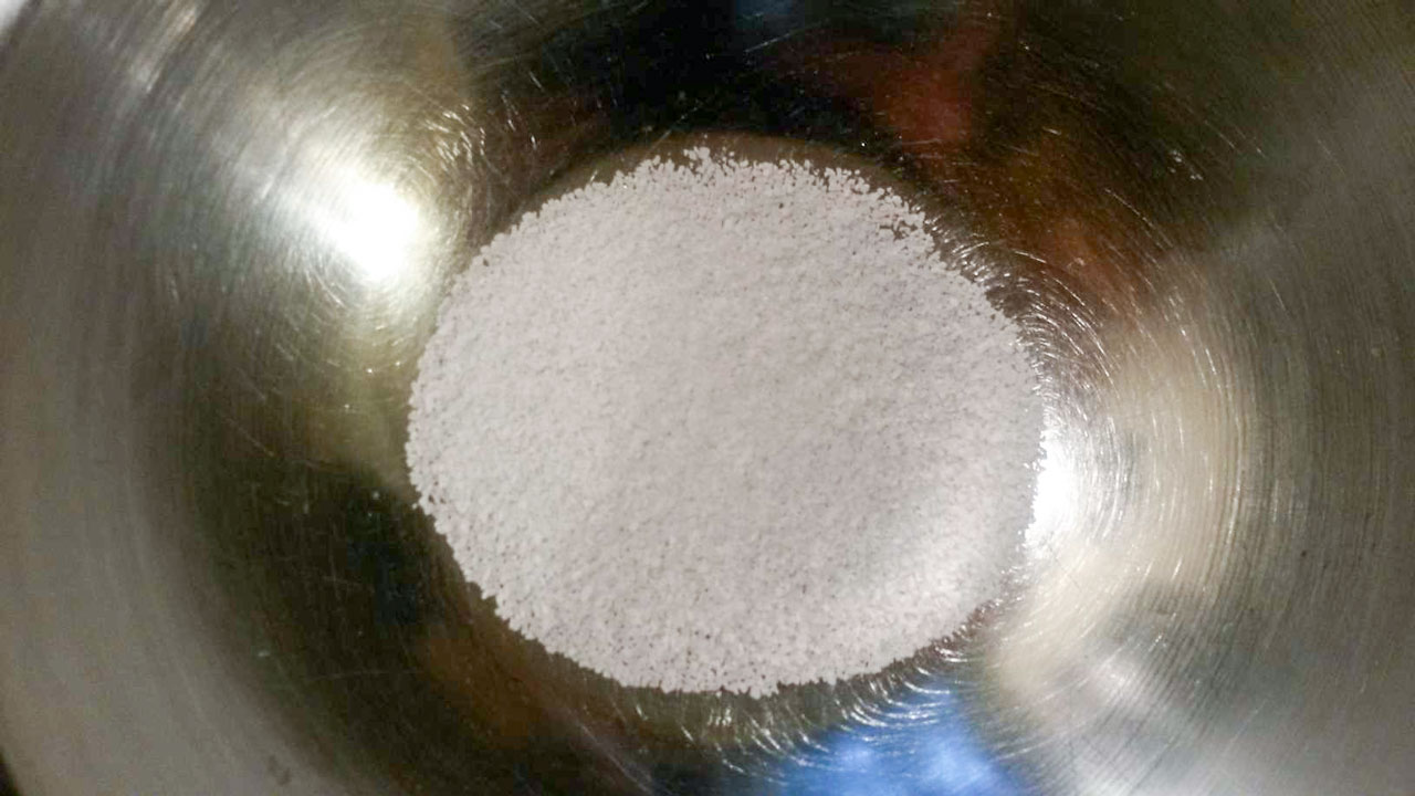 Salt added to a bowl.