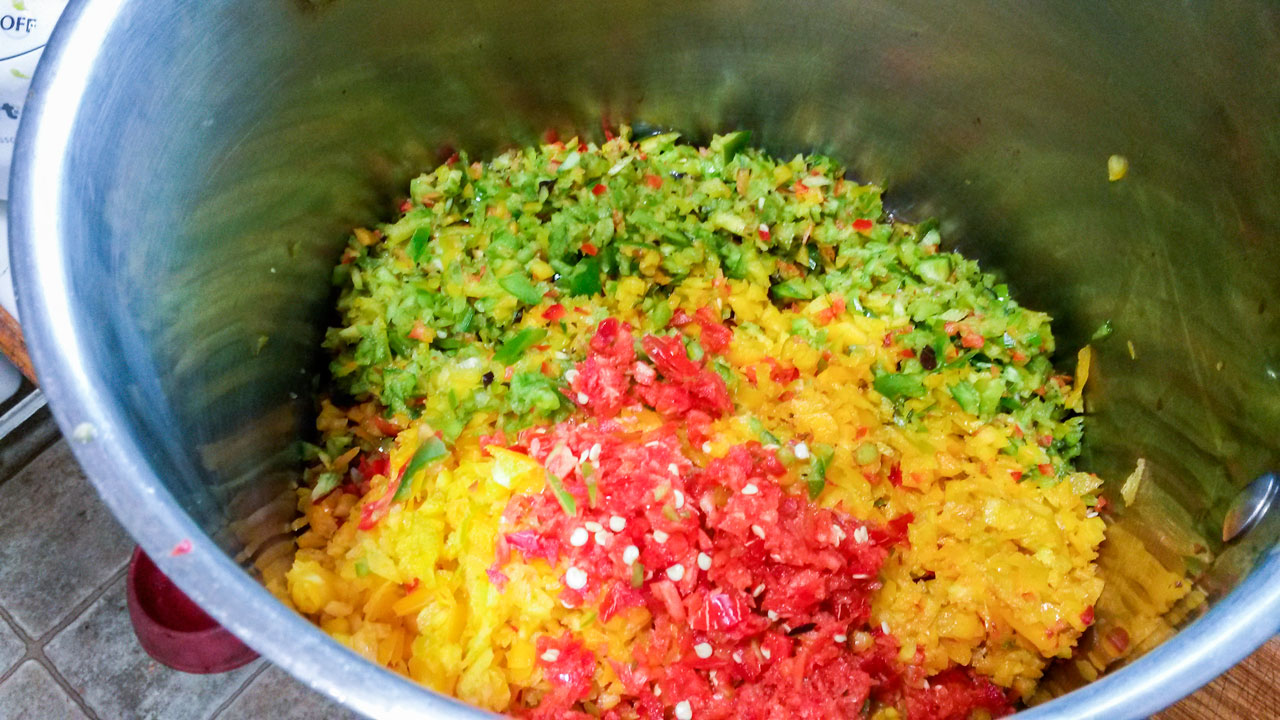 Chopped vegetables in large pot.