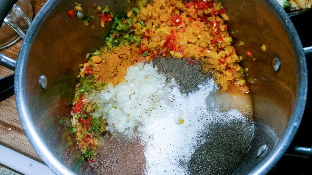 Vegetables and spices in the large pot.