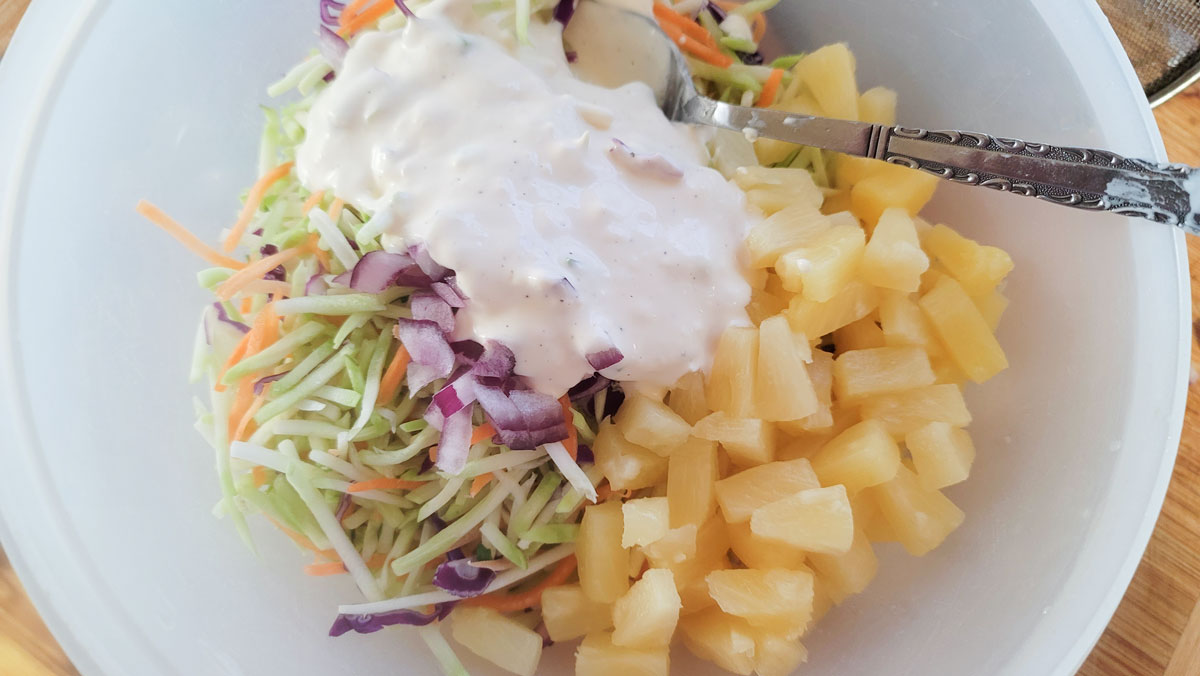 Dressing added to the cabbage mixture.