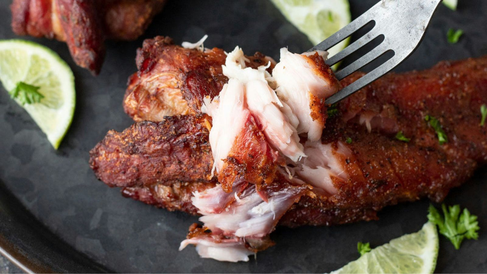 Breaking off flaky fish with a fork.