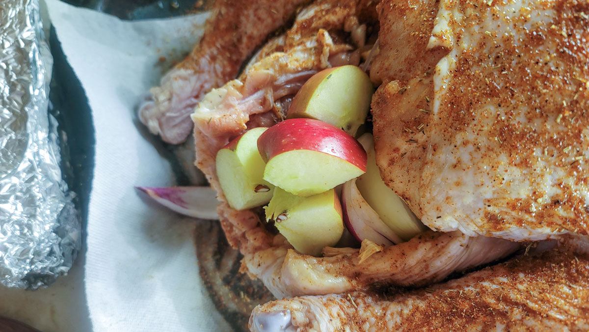 Filling the cavity with apple and carrots.