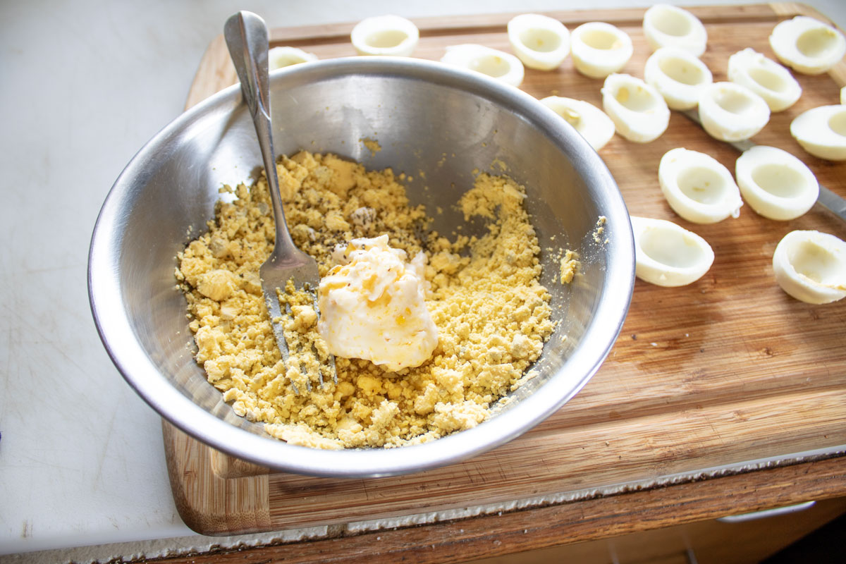 Mayonnaise added to the yolks.