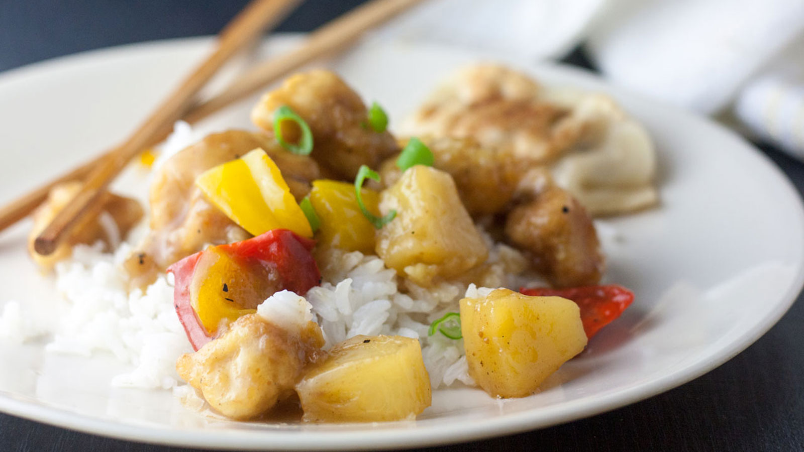 Chicken chunks with pineapple and red peppers.