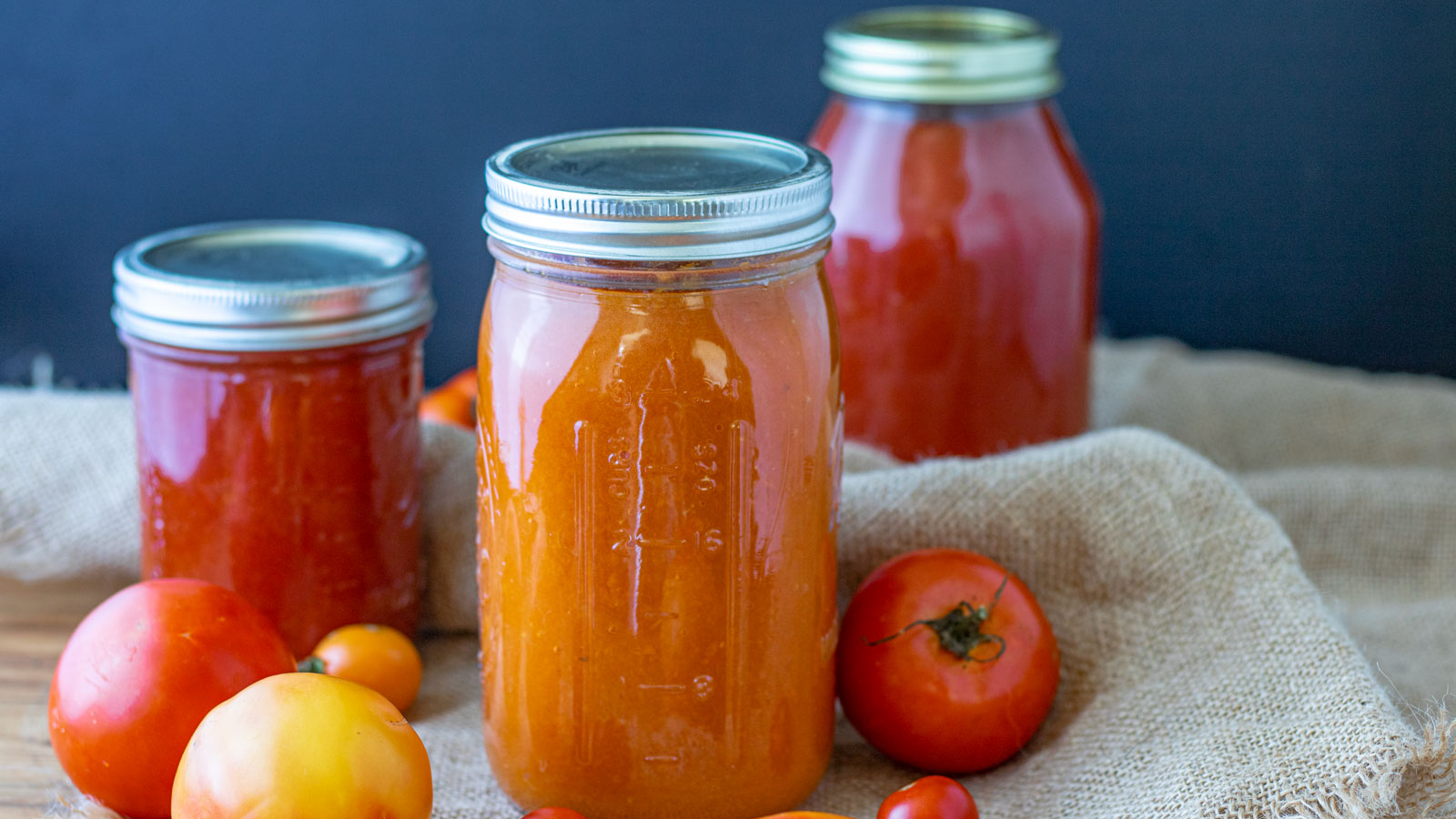 Three cans of tomato sauce.