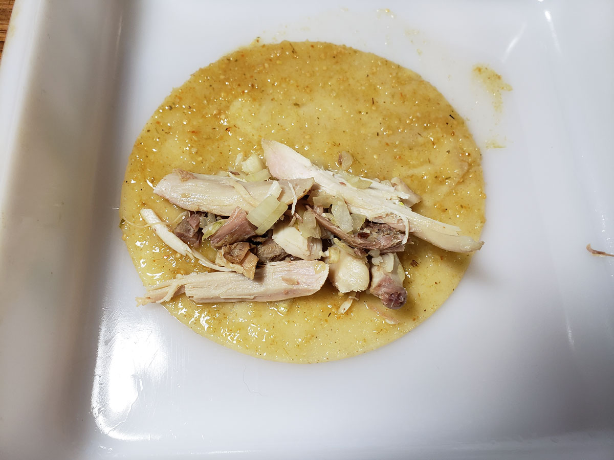 Filling added to tortilla.