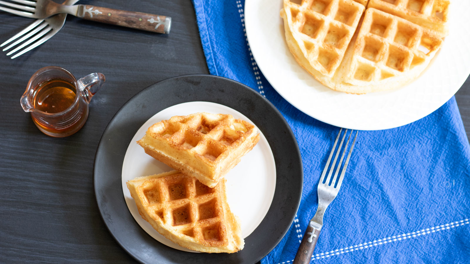belgian waffles on white and black plate