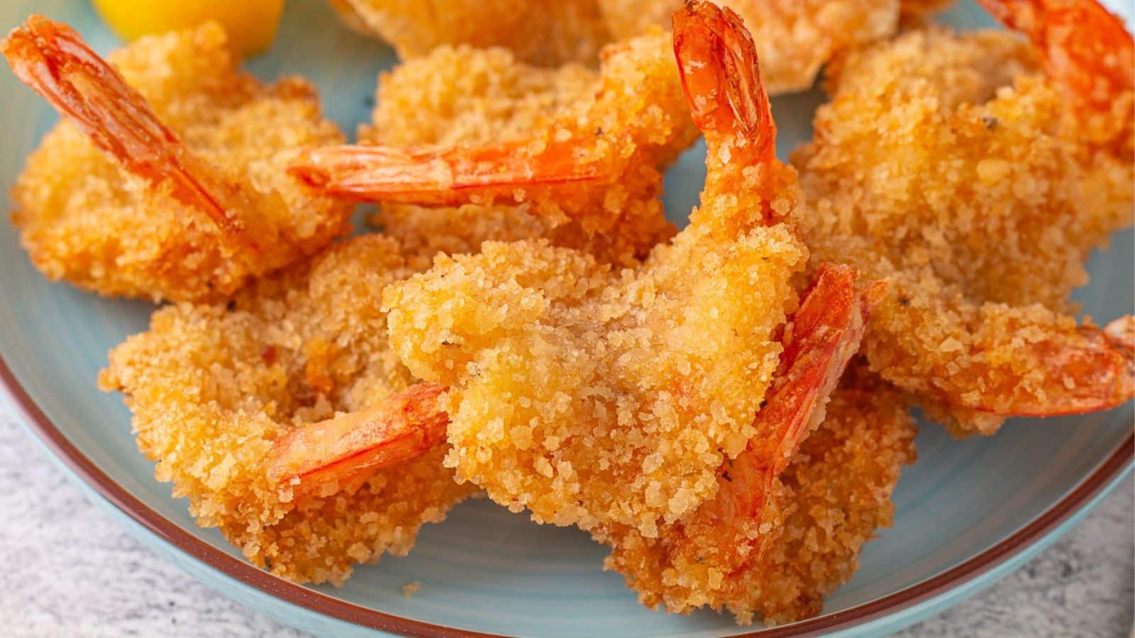 Butterfly shrimp on a plate.