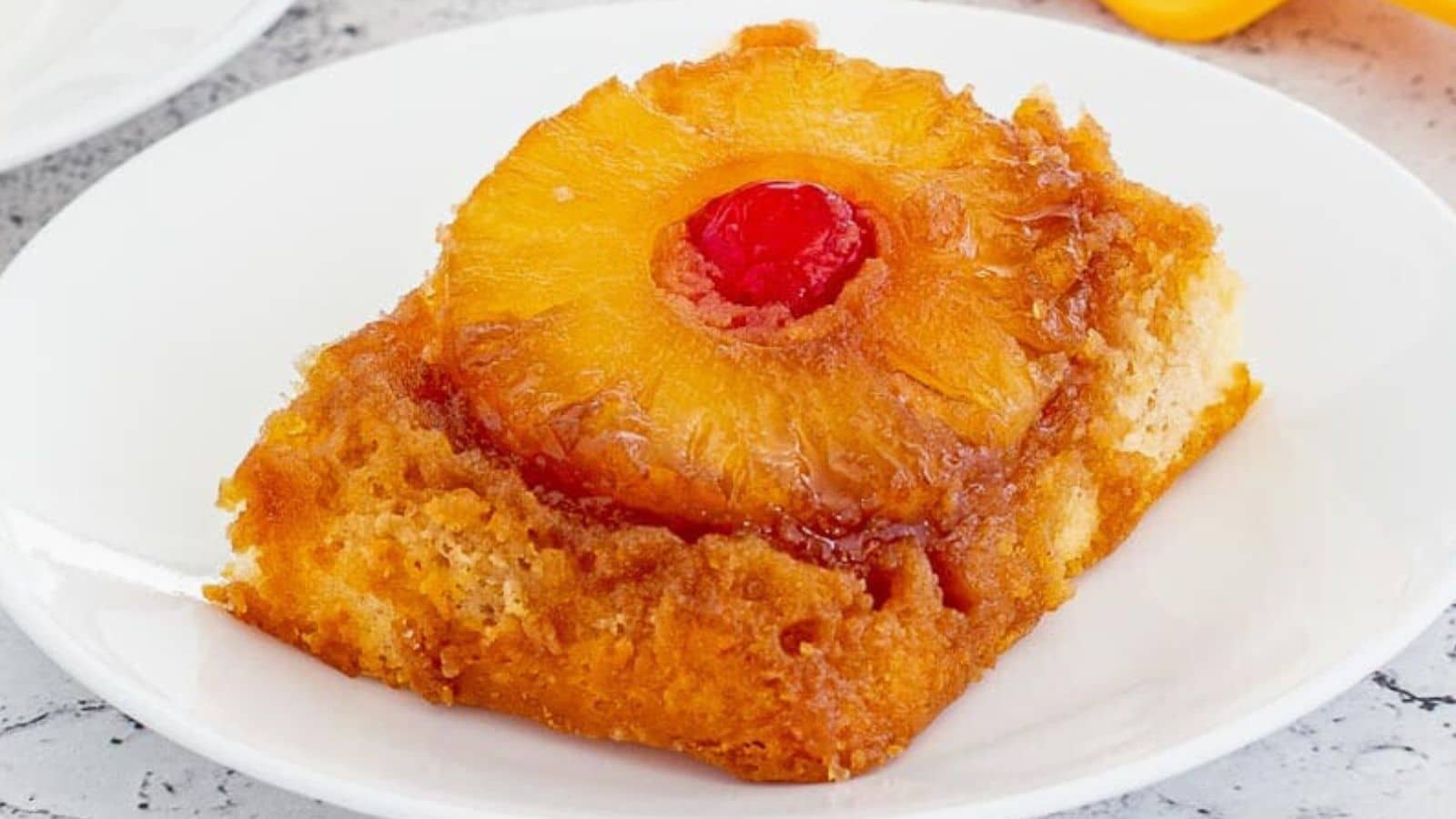 Pineapple upside down cake on a plate.
