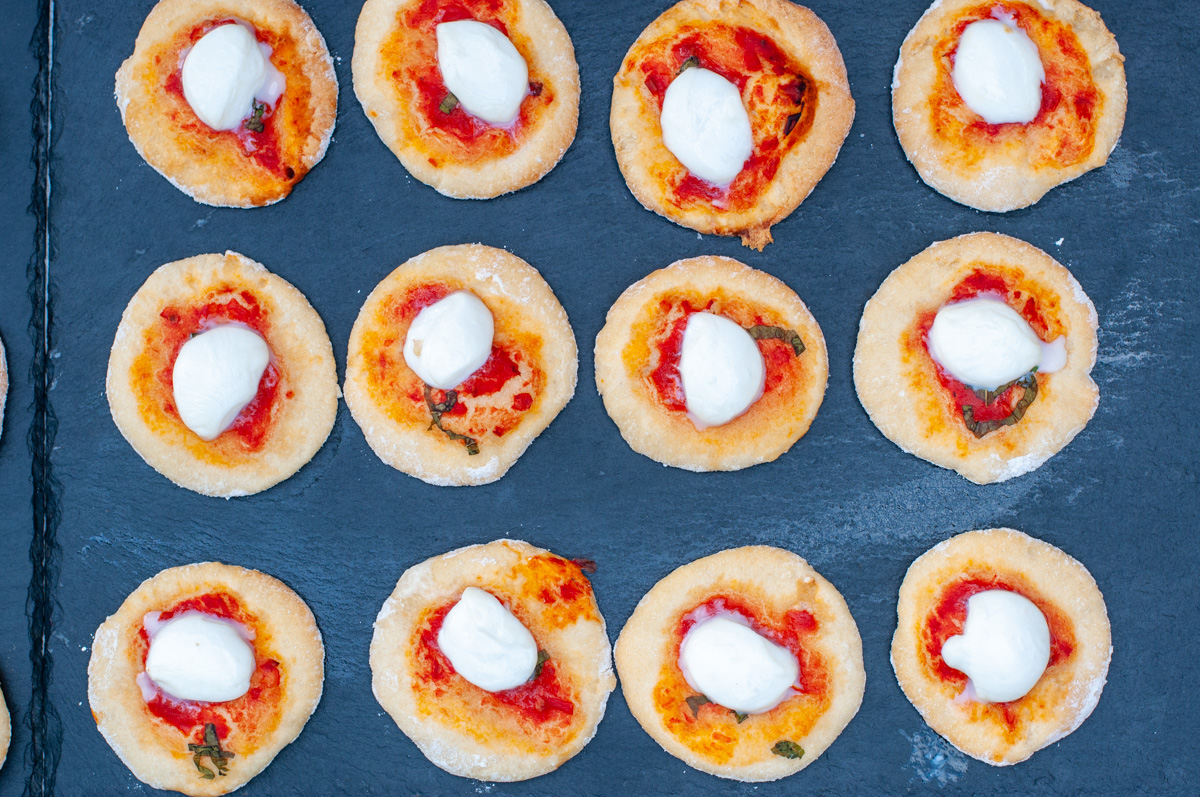 Pizzettes on a tray.