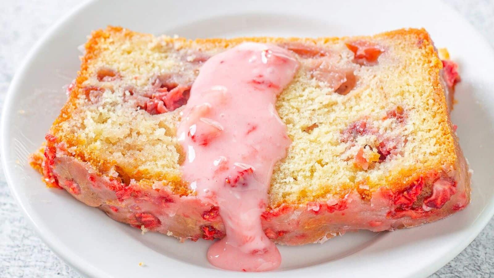 A slice of pound cake with strawberry cream on top.