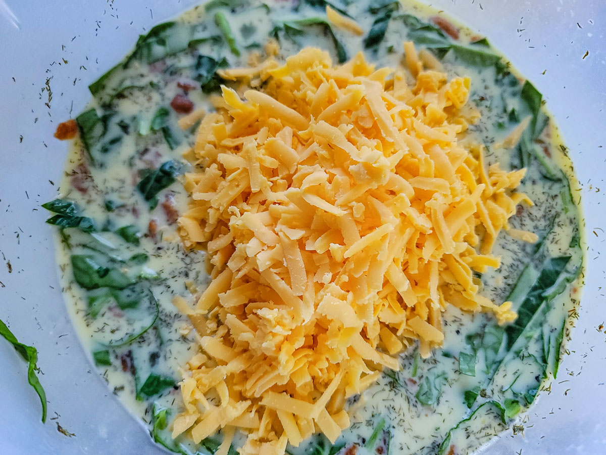 Cheese added to the egg mixture.