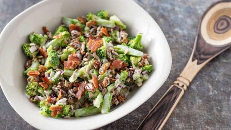 Horizontal photo of broccoli salad with custom spoon.