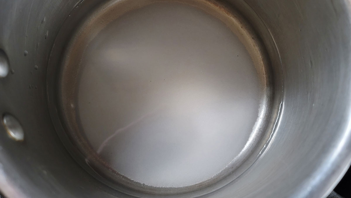 Sugar and water in a saucepan.