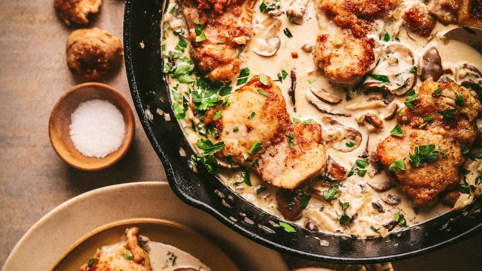 Champagne chicken in a cast iron skillet.