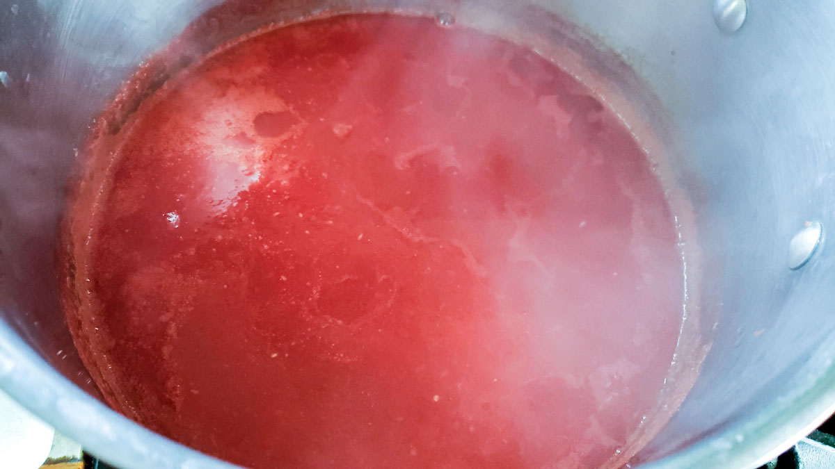 Boiling juice in a large pot.