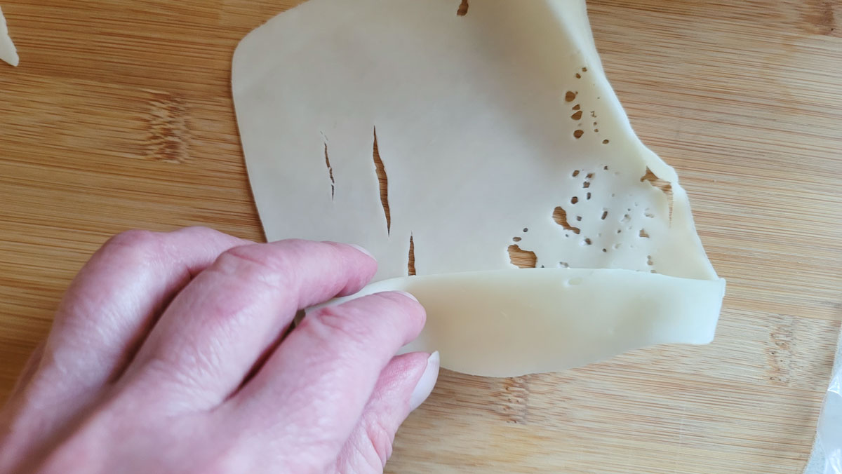 Slice of folded cheese.