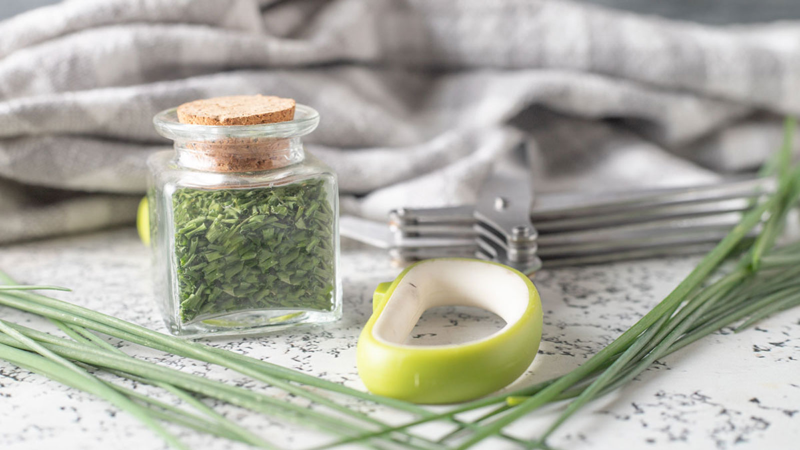 Dehydrated chives in spice jar.