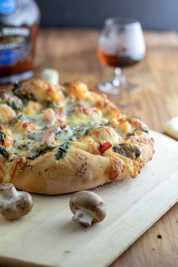 Pizza on wooden pizza peel