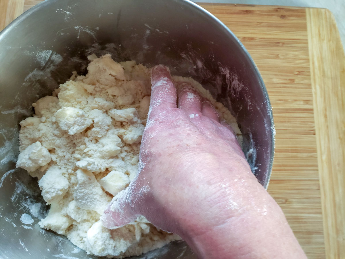 Hand mixing the dough.