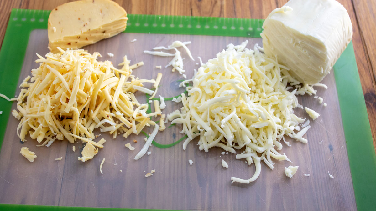 Grated cheese on a board.