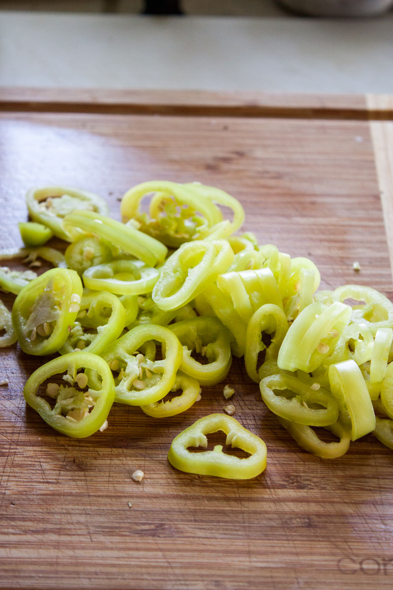 Sliced peppers on a cutting board.