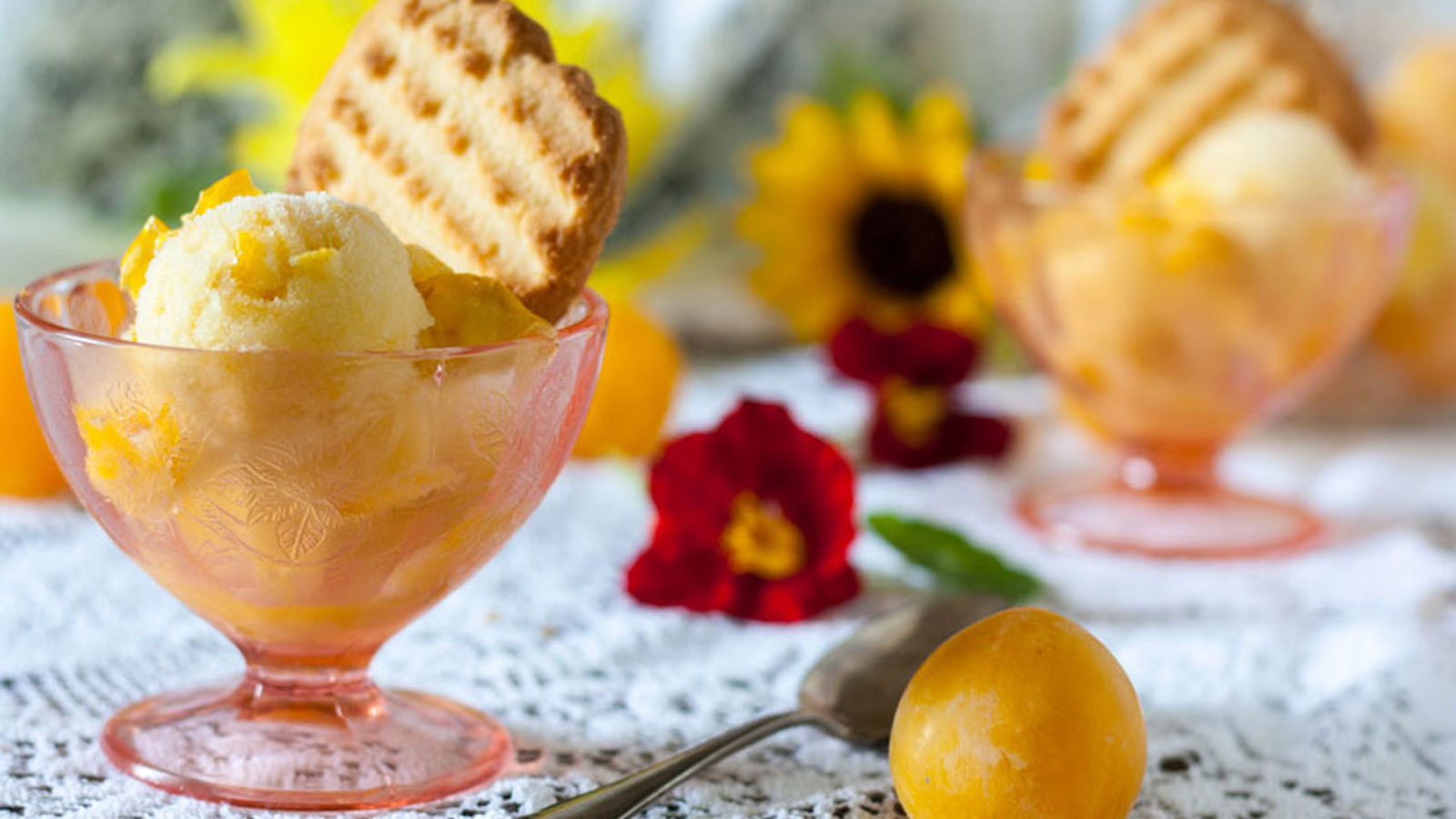 Sorbet in pink, footed dessert bowls.