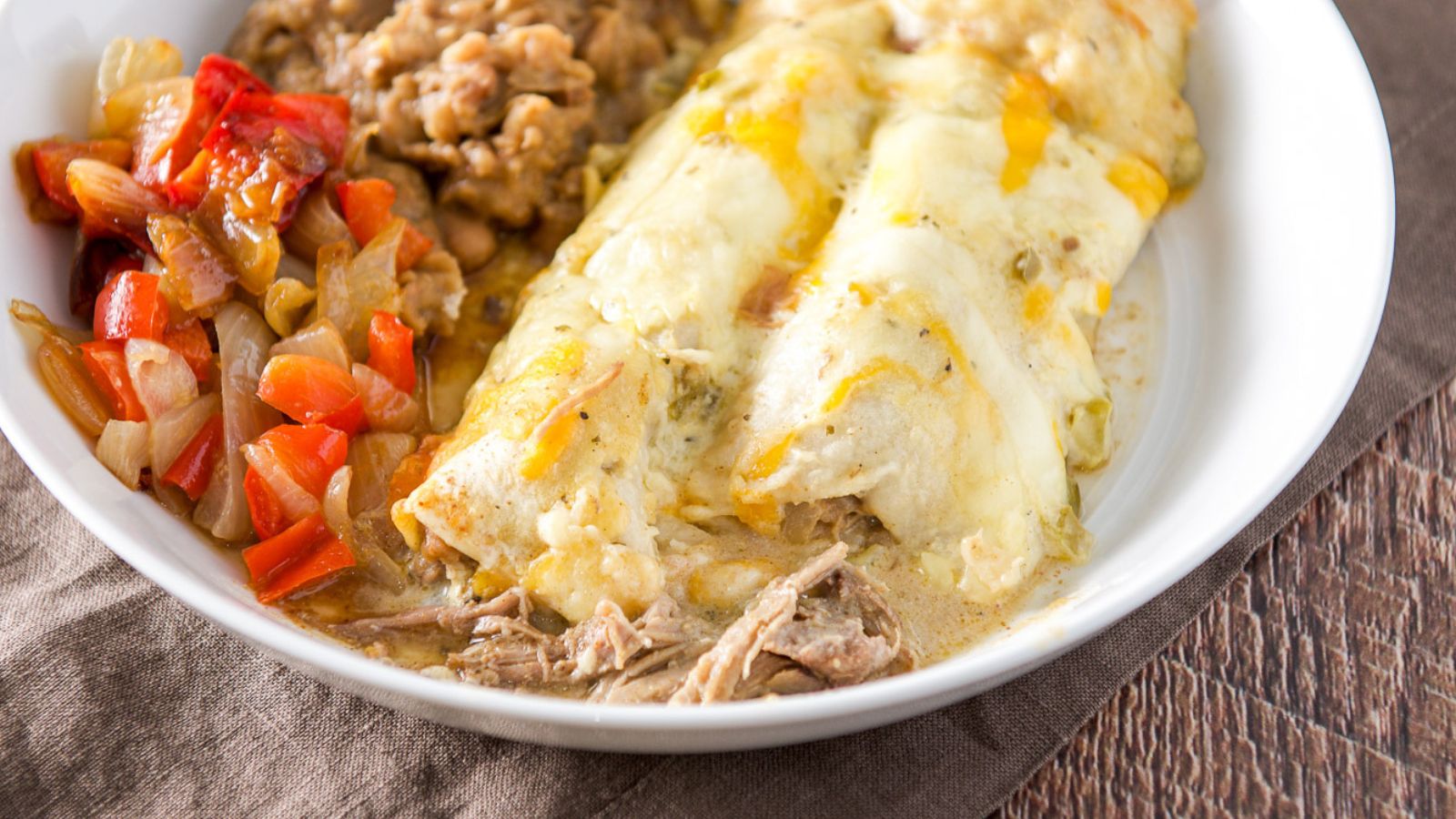 pulled pork enchiladas on a plate
