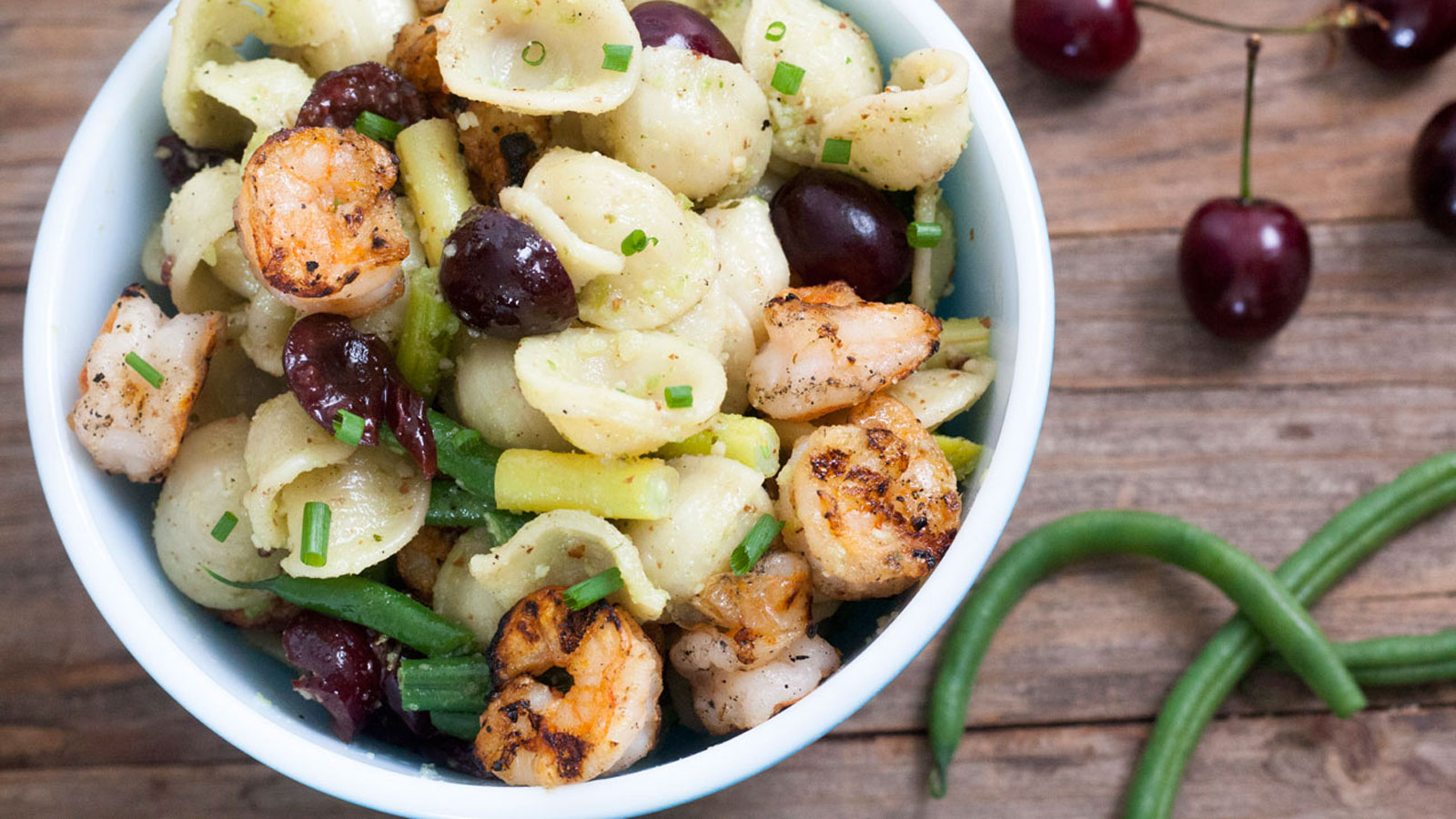 Shrimp and pasta salad in a bowl.